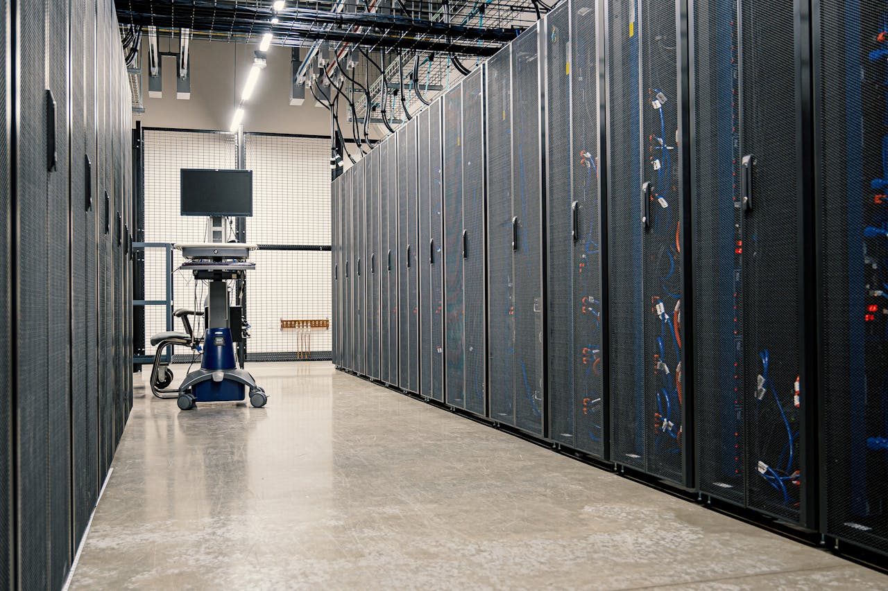 hero-img-01 Steel framework cabinets housing servers networking devices and cables in contemporary equipped data center